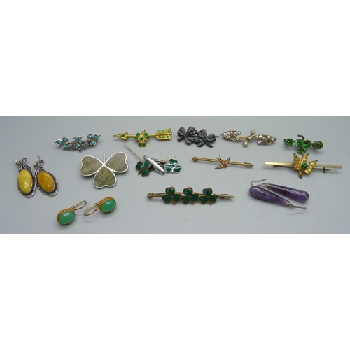 1181 - Three pairs of vintage silver set earrings, an Irish silver shamrock brooch and eight brooches