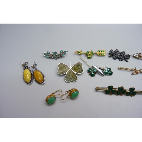 1181 - Three pairs of vintage silver set earrings, an Irish silver shamrock brooch and eight brooches