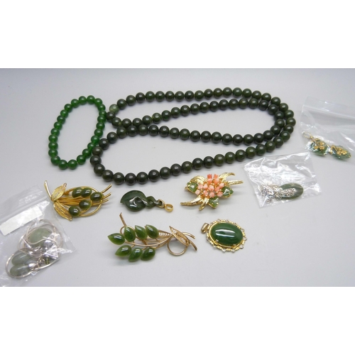 1183 - A jade bead necklace, bracelet, brooches, pendants, etc.