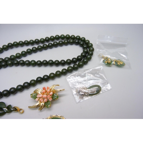 1183 - A jade bead necklace, bracelet, brooches, pendants, etc.