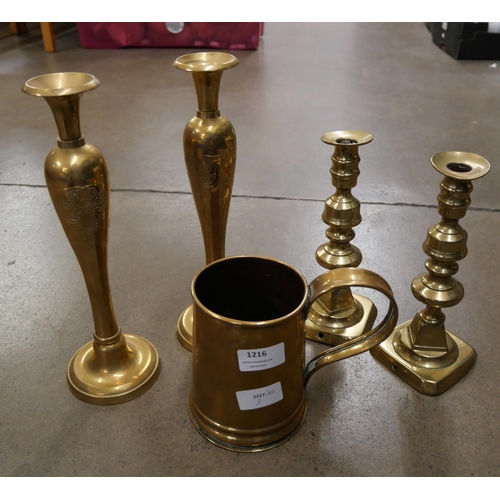 1216 - Two pairs of brass candlesticks and a brass tankard