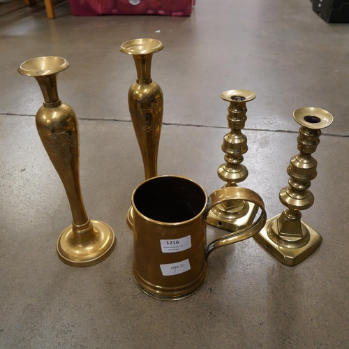 1216 - Two pairs of brass candlesticks and a brass tankard