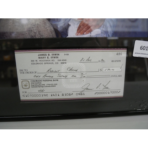601 - A signed cheque display signed by James B. Irwin, 8th person to walk on the moon