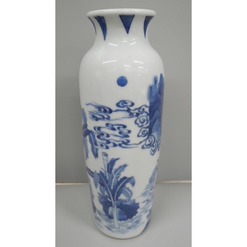 612 - A Chinese porcelain blue and white vase, decorated with figures in a landscape, crack to the centre ... 