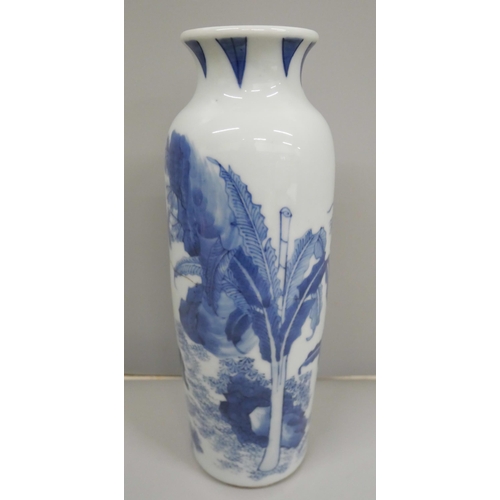 612 - A Chinese porcelain blue and white vase, decorated with figures in a landscape, crack to the centre ... 