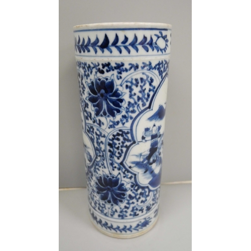 613 - A Chinese porcelain blue and white cylindrical vase, decorated with warriors on horseback, 19.5cm