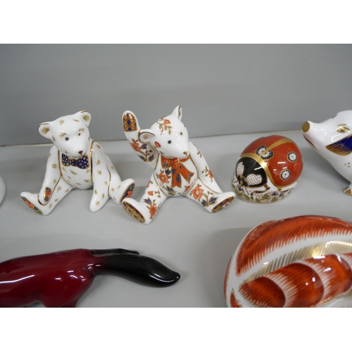 629 - Five Royal Crown Derby paperweights including sow, a Royal Doulton flambe fox and a German figure of... 
