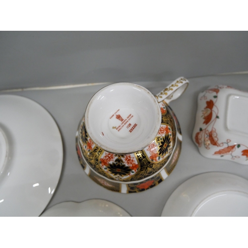 637 - A Royal Crown Derby 1128 Imari cup and saucer and three pin trays