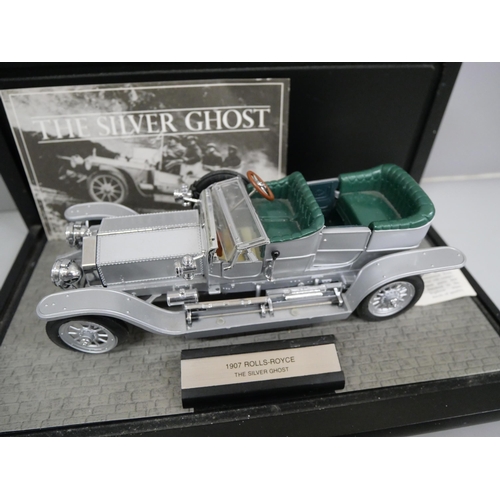 640 - A Franklin Mint model of The Silver Ghost 1907 Rolls Royce, with display case
