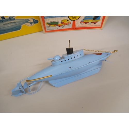 650 - A Sutcliffe Model tinplate Unda-Wunda clockwork diving submarine and a No. 76 Toytown Builders Lorry... 