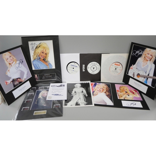 663 - A collection of Dolly Parton memorabilia -three records including a white label, autographs, signed ... 