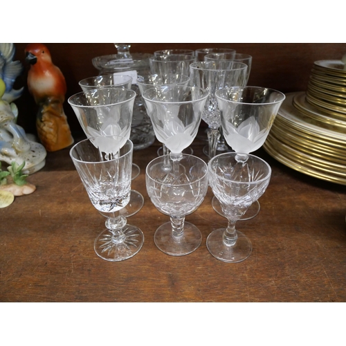 669 - A collection of Waterford crystal including drinking glasses, a biscuit barrel and a set of five sig... 