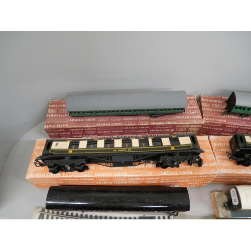 673 - Four Graham Farish OO-gauge model rail carriages, a/f, boxed, and other accessories