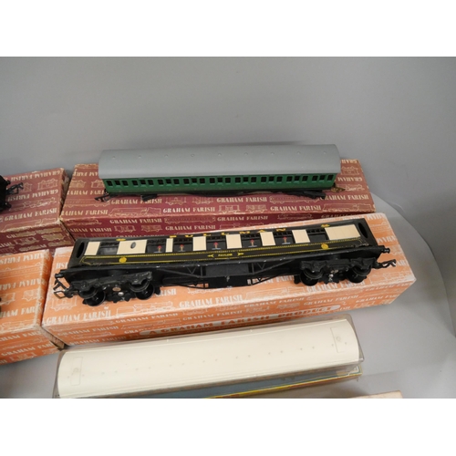 673 - Four Graham Farish OO-gauge model rail carriages, a/f, boxed, and other accessories