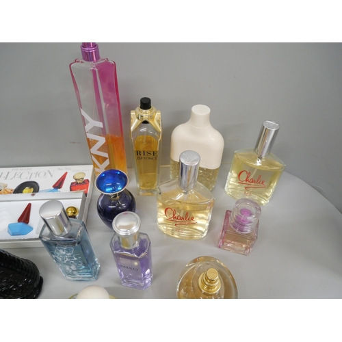 687 - A collection of perfume including Poeme, Lancôme, FCUK, miniature collection, Boss, etc.