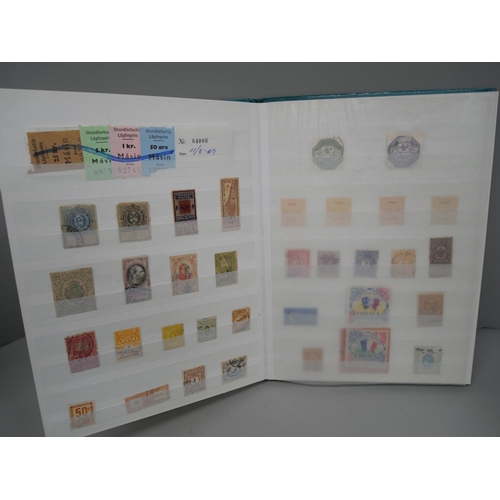 696 - Worldwide Revenue stamps in sixteen page stockbook