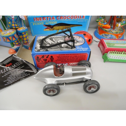 712 - A replica Schuco Studio Mercedes Grand Prix 1936, boxed and other modern tinplate toys including Hap... 