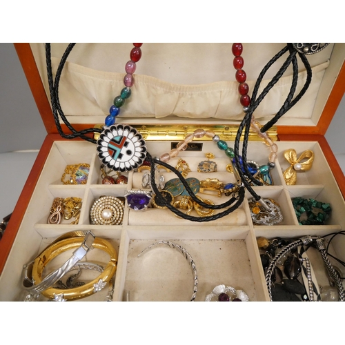 715 - A jewellery box containing costume jewellery
