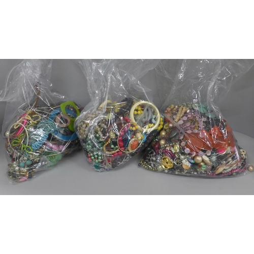 716 - Three large bags of costume jewellery