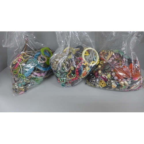 716 - Three large bags of costume jewellery