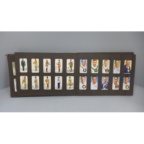 728 - A quantity of cigarette cards, some loose and in albums