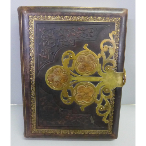 769 - A large leather and brass bound album with CDVs and cabinet cards