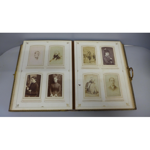 769 - A large leather and brass bound album with CDVs and cabinet cards