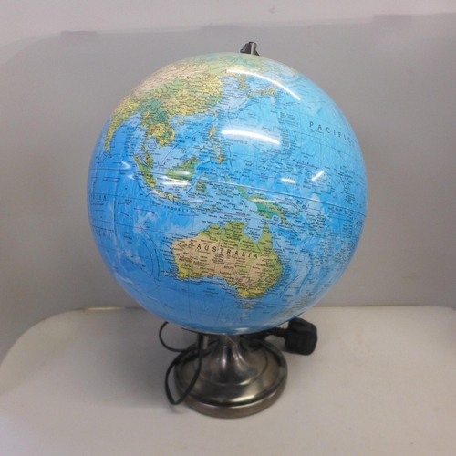 773 - A Phillip's London library globe and two modern globes, larger with lamp fitting