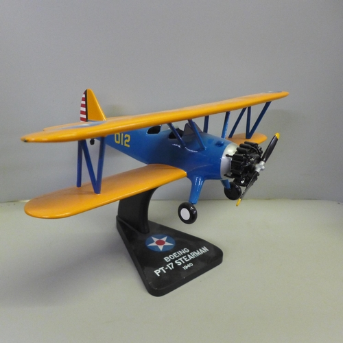 783 - A model Boeing PT-17 Stearman bi-plane, a 70th anniversary Lancaster bomber display, two Corgi aircr... 