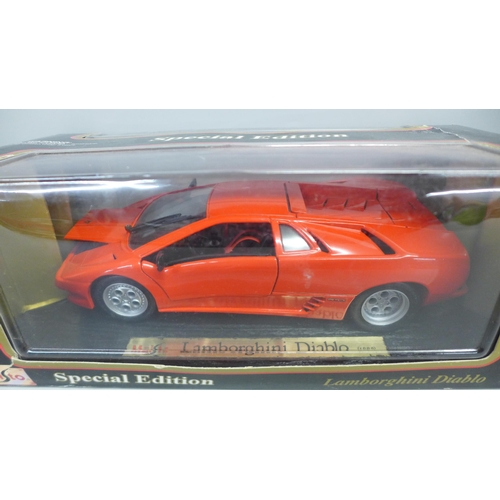 789 - A collection of 1/18 scale model vehicles, Maisto and Burago, including Jaguar E type, other model v... 