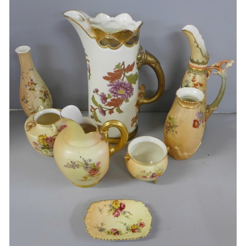 802 - A collection of Royal Worcester blush ivory including a large ewer, flatbacked jug, vases and pots, ... 