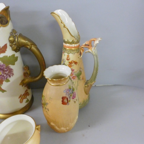 802 - A collection of Royal Worcester blush ivory including a large ewer, flatbacked jug, vases and pots, ... 