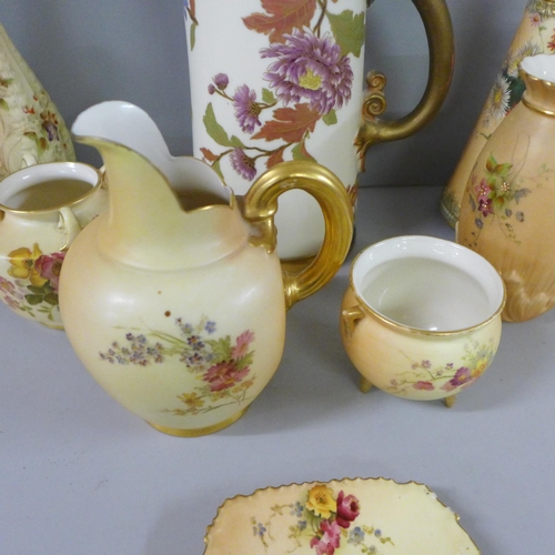 802 - A collection of Royal Worcester blush ivory including a large ewer, flatbacked jug, vases and pots, ... 