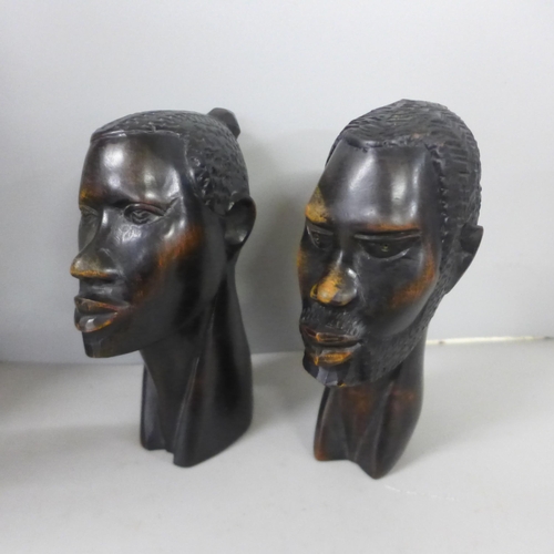 811 - An African hand carved hardwood tribal mask, 38cm, a hand carved pair of hardwood African busts, 16c... 