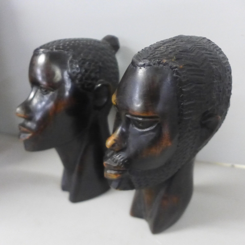 811 - An African hand carved hardwood tribal mask, 38cm, a hand carved pair of hardwood African busts, 16c... 