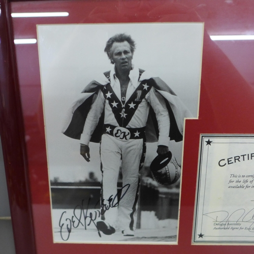 817 - Evel Knievel autographed photograph and display, signed twice