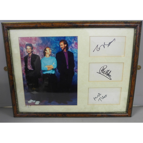 820 - A Genisis autographed display - Phil Collins, Tony Banks and Mike Rutherford