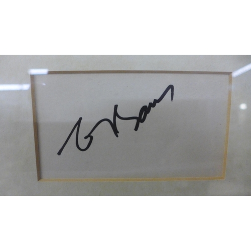 820 - A Genisis autographed display - Phil Collins, Tony Banks and Mike Rutherford