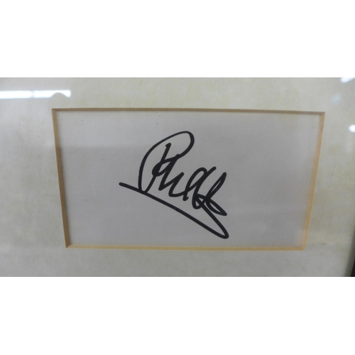 820 - A Genisis autographed display - Phil Collins, Tony Banks and Mike Rutherford