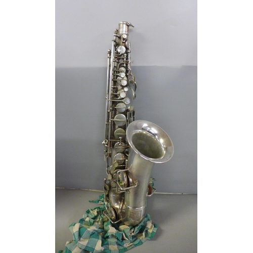 828 - A saxophone, cased