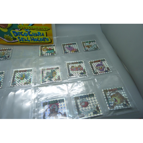 845 - An album of Pokemon Deco Chara Seal holder stickers and approximately twenty five Japanese Amada sti... 