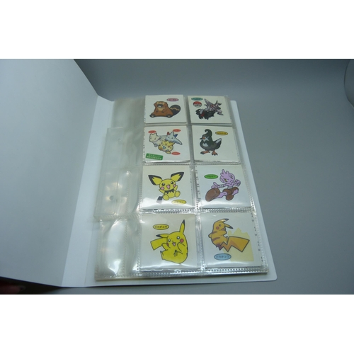 845 - An album of Pokemon Deco Chara Seal holder stickers and approximately twenty five Japanese Amada sti... 