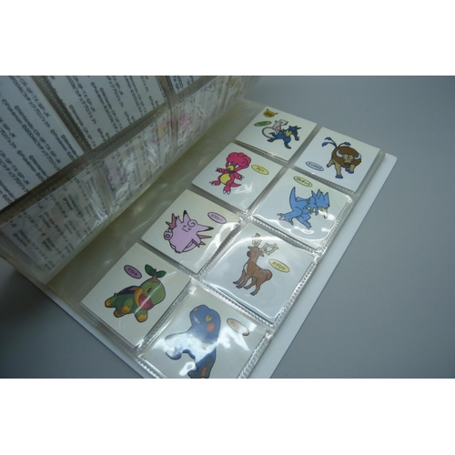 845 - An album of Pokemon Deco Chara Seal holder stickers and approximately twenty five Japanese Amada sti... 