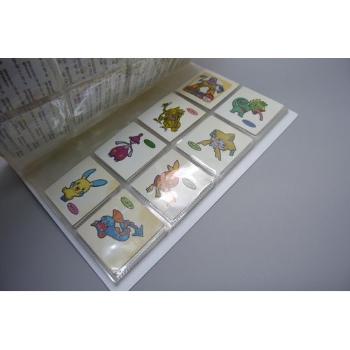 845 - An album of Pokemon Deco Chara Seal holder stickers and approximately twenty five Japanese Amada sti... 