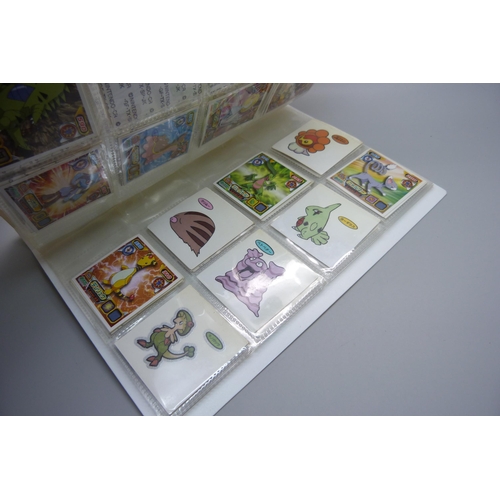 845 - An album of Pokemon Deco Chara Seal holder stickers and approximately twenty five Japanese Amada sti... 