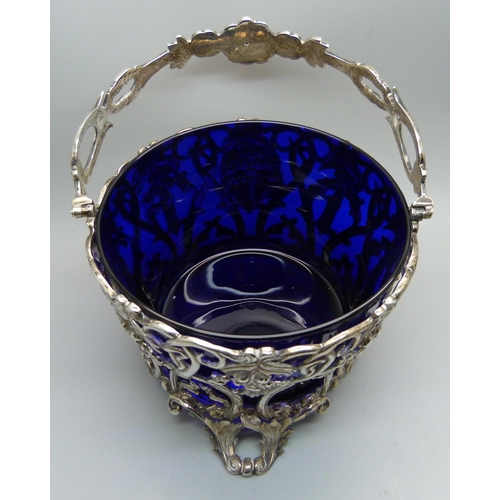 860 - A Victorian pierced silver basket with blue glass liner, London 1842, James Charles Edington, 425g, ... 