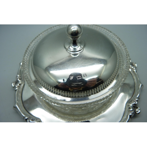 862 - A glass dish on a silver stand and with silver lid, also a silver and mother of pearl knife, (99g wi... 