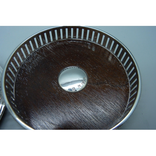 863 - A pair of silver wine coasters, diameter 9cm