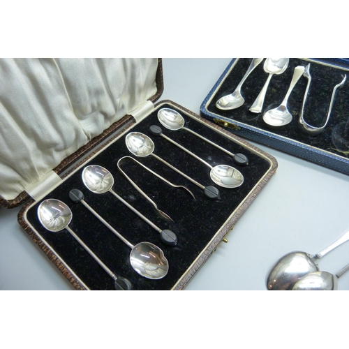 865 - Three cased sets of silver spoons, 162g, (one pair of sugar bows plated, one associated box, one spo... 