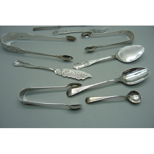 882 - A collection of silver spoons, pickle forks, sugar bows, 180g